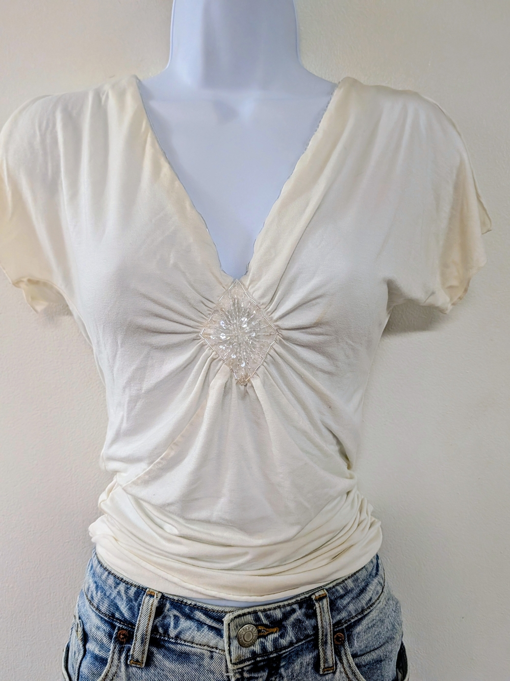 Express Cream V-Neck Short Sleeve Top with Center Embellishment